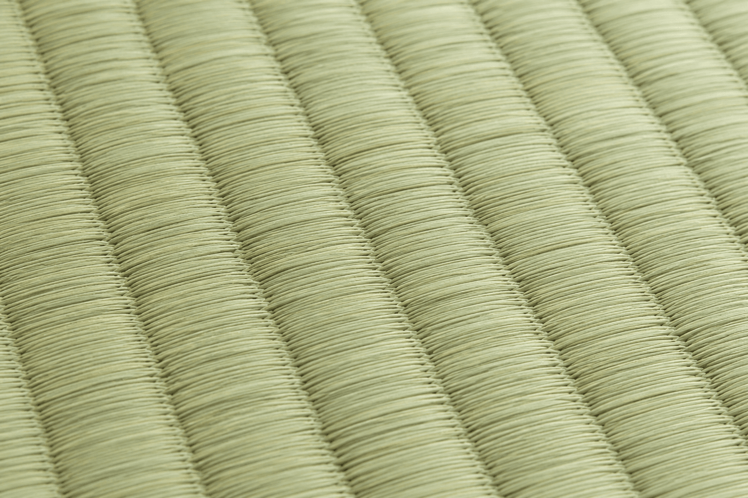 Close-up of woven rush grass on authentic Japanese tatami surface
